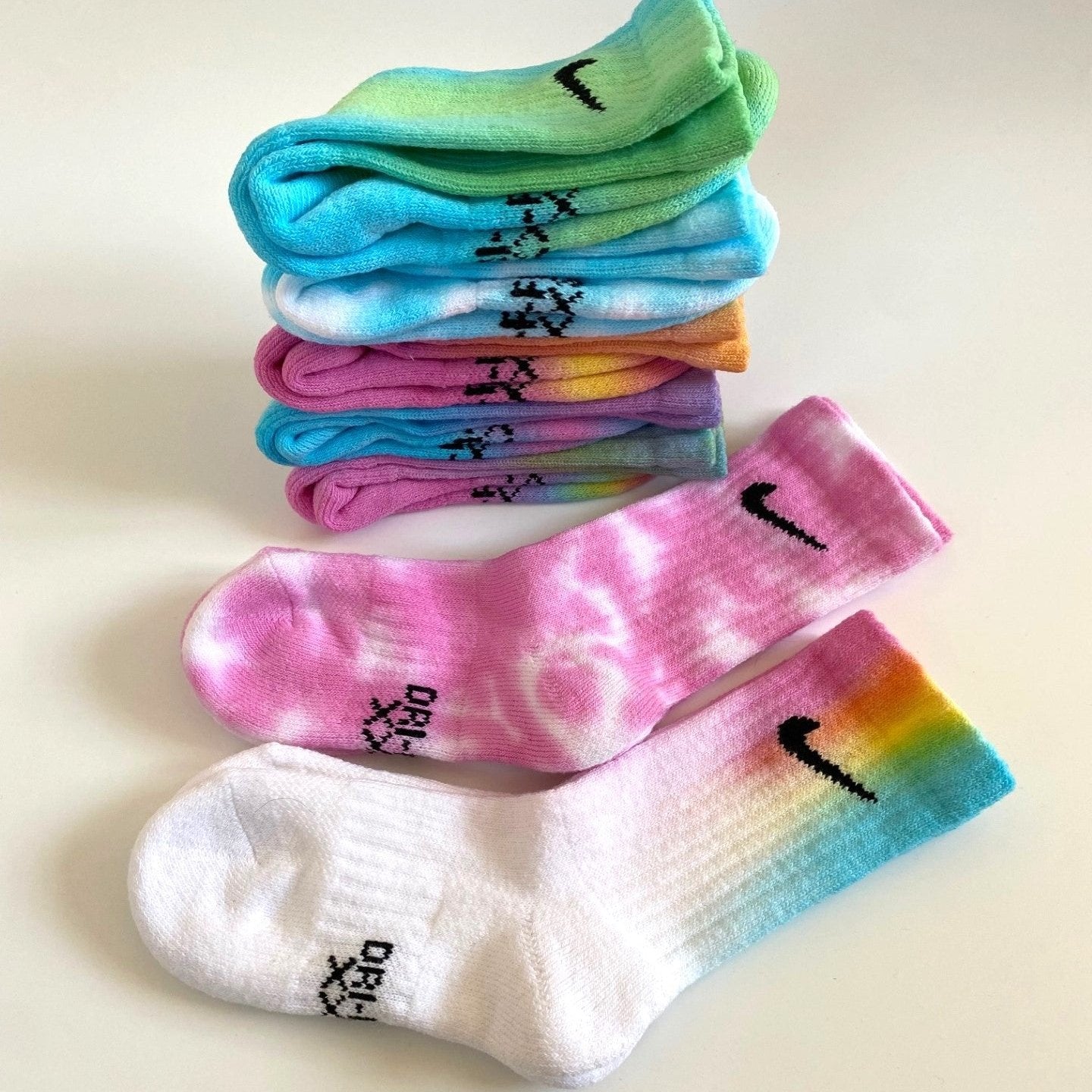 Group of kids Nike XS tie dye socks rainbow colours