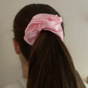 Pink satin scrunchie in hair